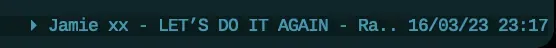 tmux status bar showing Spotify track and artist